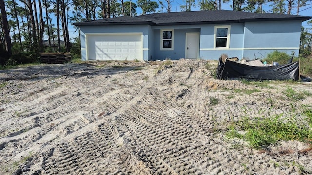 5229 Chaney Ter, Port Charlotte, FL 33981 - view of front of home with a garage and stucco siding