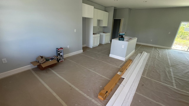 5229 Chaney Ter, Port Charlotte, FL 33981 - unfurnished living room featuring baseboards