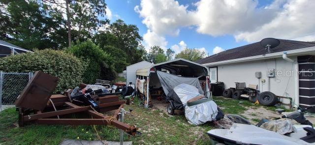 1160 W Geneva Pl, Citrus Springs, FL 34434 - view of yard with a carport