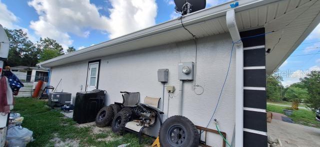 1160 W Geneva Pl, Citrus Springs, FL 34434 - view of side of property with stucco siding