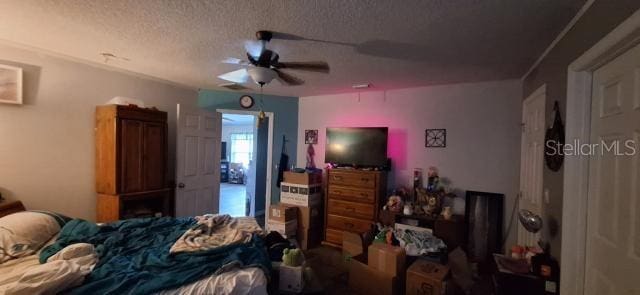 1160 W Geneva Pl, Citrus Springs, FL 34434 - bedroom featuring a textured ceiling and ceiling fan