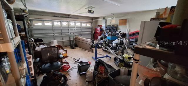 1160 W Geneva Pl, Citrus Springs, FL 34434 - garage featuring a garage door opener