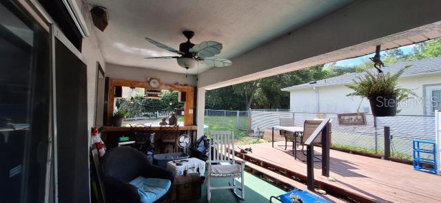 1160 W Geneva Pl, Citrus Springs, FL 34434 - wooden deck with ceiling fan