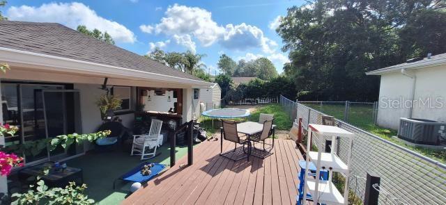 1160 W Geneva Pl, Citrus Springs, FL 34434 - deck with central AC unit and outdoor dining space