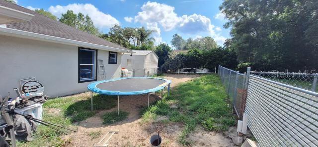 1160 W Geneva Pl, Citrus Springs, FL 34434 - view of yard with a trampoline