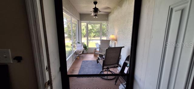 1160 W Geneva Pl, Citrus Springs, FL 34434 - sunroom / solarium with a ceiling fan