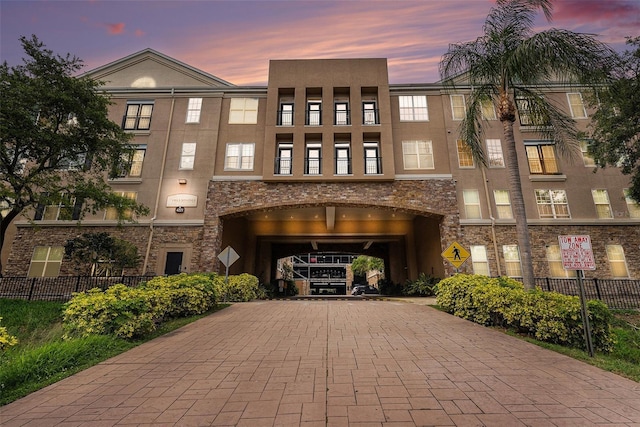 4221 W Spruce St Unit 2104, Tampa, FL 33607 - view of building exterior featuring decorative driveway and a garage
