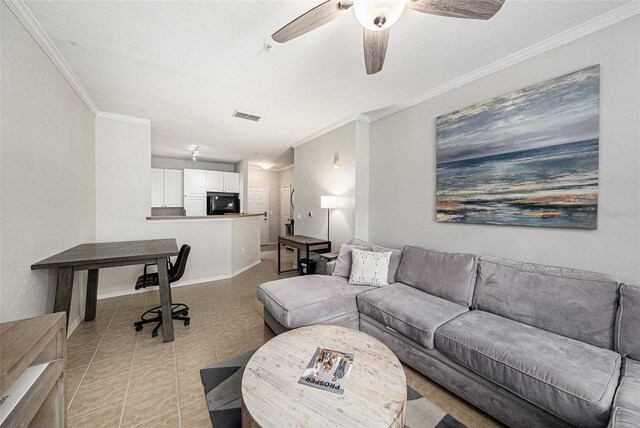 4221 W Spruce St Unit 2104, Tampa, FL 33607 - living room featuring ornamental molding, light tile patterned floors, and ceiling fan