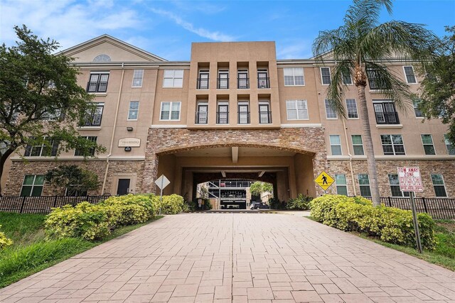4221 W Spruce St Unit 2104, Tampa, FL 33607 - view of building exterior featuring decorative driveway