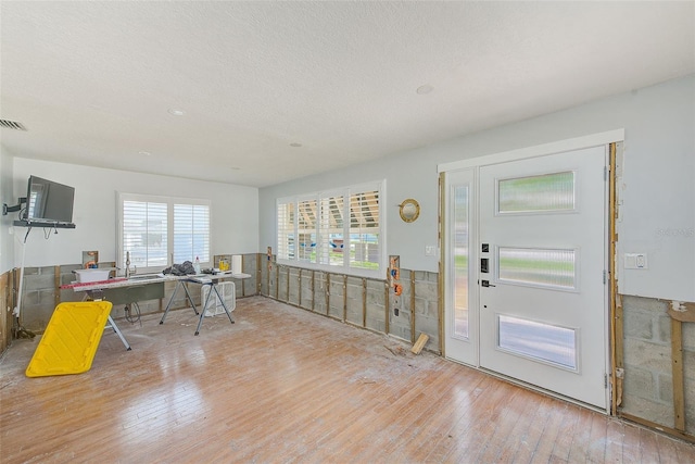 112 11th Ave, Indian Rocks Beach, FL 33785 - office area featuring hardwood / wood-style flooring and a textured ceiling