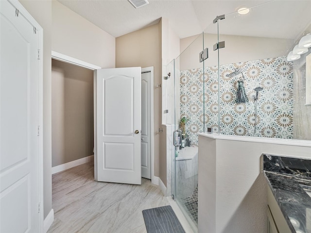 31201 Shaker Cir, Wesley Chapel, FL 33543 - bathroom with a stall shower, vanity, lofted ceiling, and baseboards