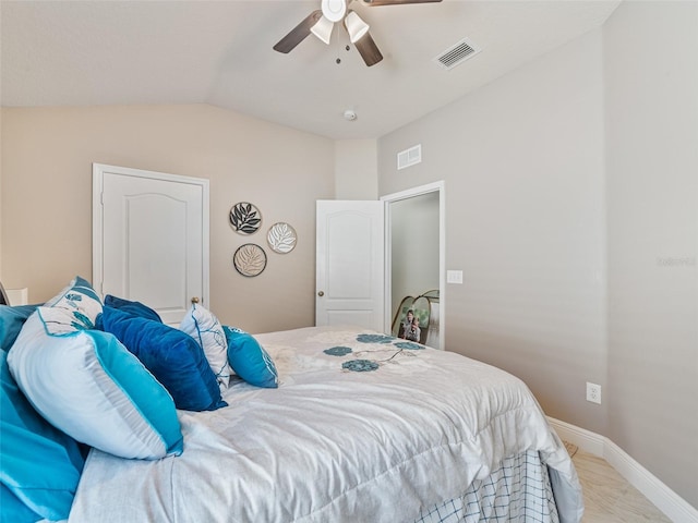 31201 Shaker Cir, Wesley Chapel, FL 33543 - bedroom with lofted ceiling, ceiling fan, and baseboards