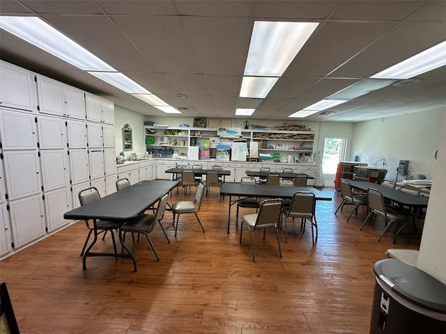 5220 Brittany Dr S Unit 1306, Saint Petersburg, FL 33715 - dining room with wood finished floors and a paneled ceiling