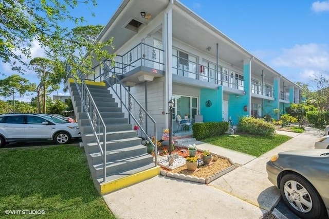 4325 58th Way N Unit 1527, Kenneth City, FL 33709 - view of property featuring stairway