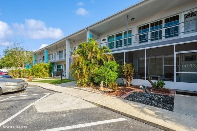 4325 58th Way N Unit 1527, Kenneth City, FL 33709 - view of building exterior with uncovered parking