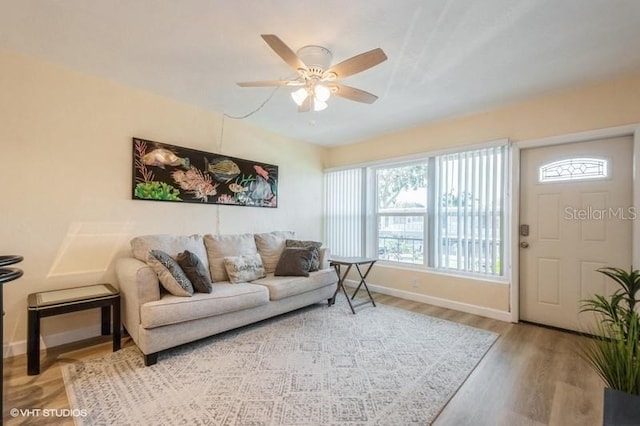 4325 58th Way N Unit 1527, Kenneth City, FL 33709 - living area featuring baseboards, a ceiling fan, and light wood-style flooring