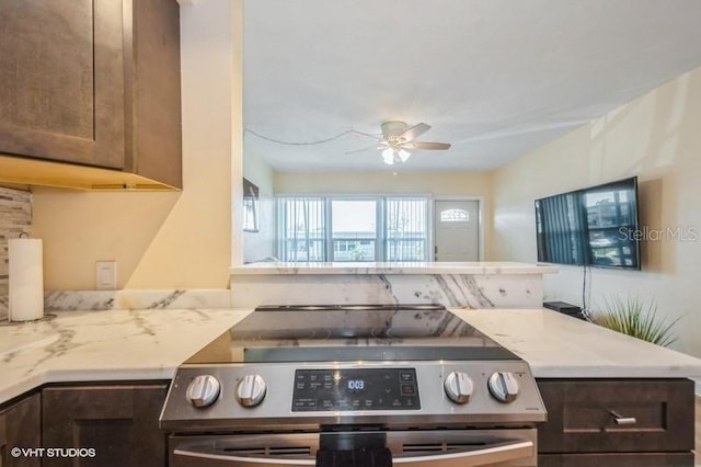 4325 58th Way N Unit 1527, Kenneth City, FL 33709 - kitchen with stainless steel electric stove, a ceiling fan, and dark brown cabinets