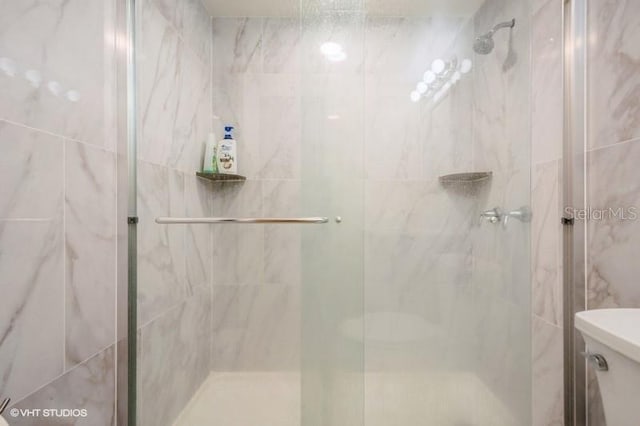 4325 58th Way N Unit 1527, Kenneth City, FL 33709 - bathroom with a shower stall and toilet
