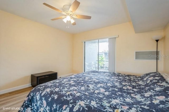 4325 58th Way N Unit 1527, Kenneth City, FL 33709 - bedroom featuring wood finished floors, baseboards, ceiling fan, and access to outside