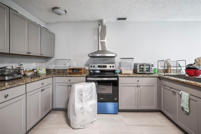 2174 62nd St N, Clearwater, FL 33760 - kitchen with stainless steel electric range oven, wall chimney exhaust hood, gray cabinetry, and a textured ceiling