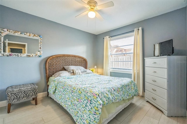 12838 Tallowood Dr, Riverview, FL 33579 - bedroom with light wood finished floors, ceiling fan, and baseboards