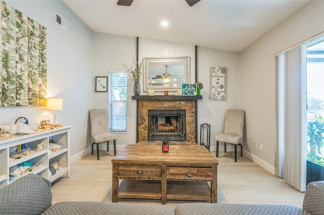 12838 Tallowood Dr, Riverview, FL 33579 - living area with ceiling fan, lofted ceiling, wood finished floors, a fireplace, and baseboards