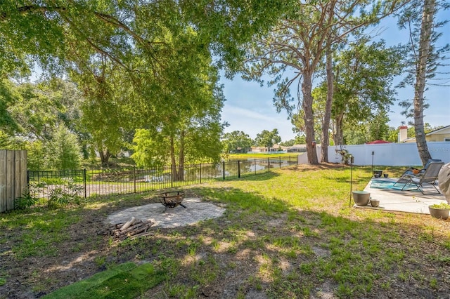 12838 Tallowood Dr, Riverview, FL 33579 - view of yard with an outdoor fire pit and a patio