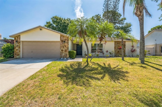12838 Tallowood Dr, Riverview, FL 33579 - view of front of house featuring an attached garage, driveway, a front lawn, stone siding, and stucco siding