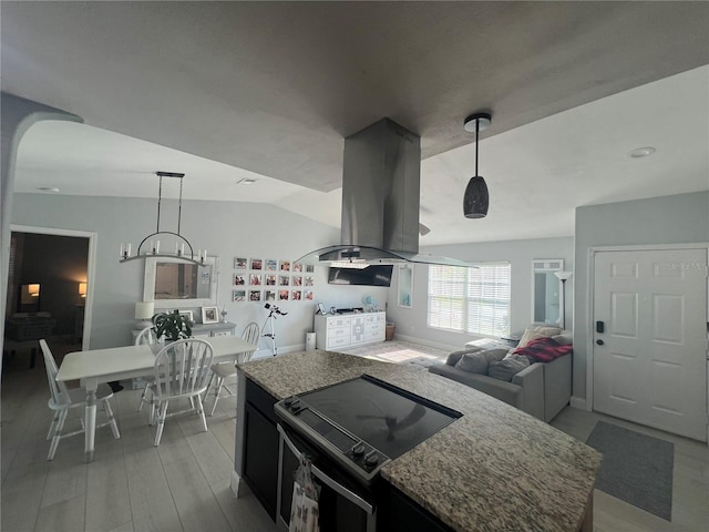 12838 Tallowood Dr, Riverview, FL 33579 - kitchen featuring black electric range, island range hood, open floor plan, light wood finished floors, and hanging light fixtures