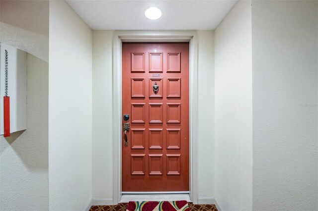 6322 Palma Del Mar Blvd S Unit 1107, Saint Petersburg, FL 33715 - doorway to property featuring stucco siding