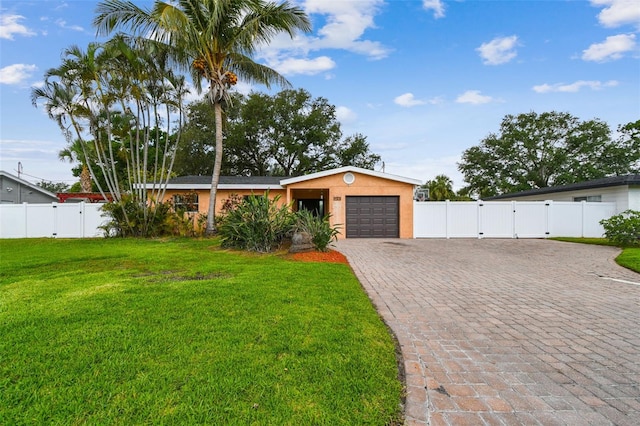 4400 Helena St NE, Saint Petersburg, FL 33703 - ranch-style house featuring a gate, a garage, decorative driveway, and stucco siding