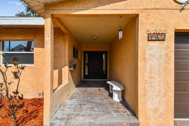 4400 Helena St NE, Saint Petersburg, FL 33703 - entrance to property featuring stucco siding
