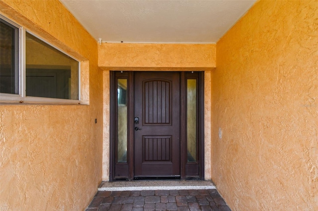 4400 Helena St NE, Saint Petersburg, FL 33703 - view of exterior entry featuring stucco siding