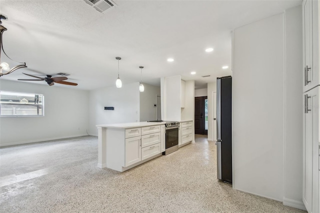 4400 Helena St NE, Saint Petersburg, FL 33703 - kitchen with appliances with stainless steel finishes, white cabinetry, recessed lighting, baseboards, and ceiling fan