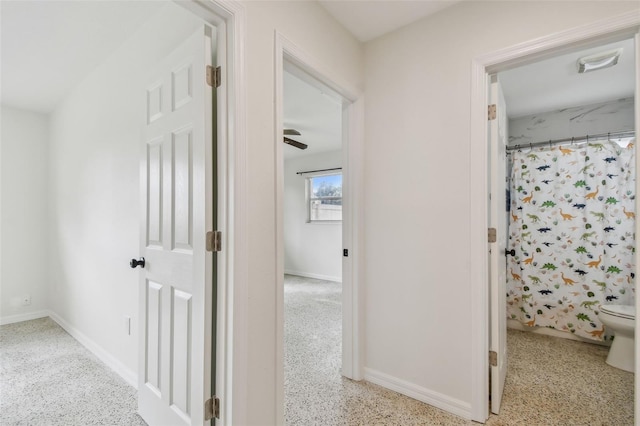 4400 Helena St NE, Saint Petersburg, FL 33703 - hall with baseboards and speckle patterned floor