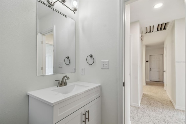 4400 Helena St NE, Saint Petersburg, FL 33703 - bathroom featuring vanity, baseboards, and speckle patterned floor