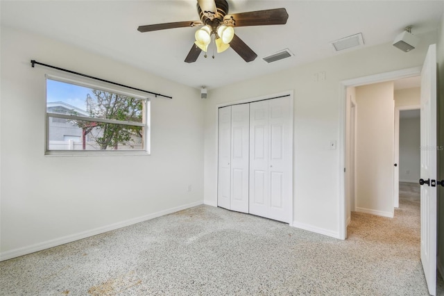 4400 Helena St NE, Saint Petersburg, FL 33703 - unfurnished bedroom with baseboards, a closet, and ceiling fan