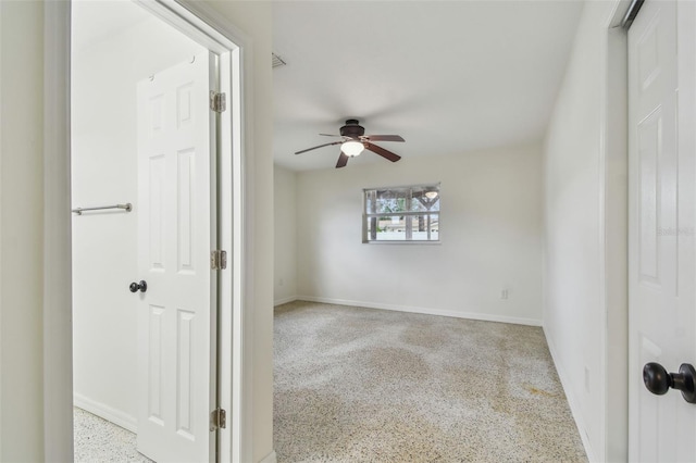 4400 Helena St NE, Saint Petersburg, FL 33703 - spare room featuring speckle patterned floor, a ceiling fan, and baseboards