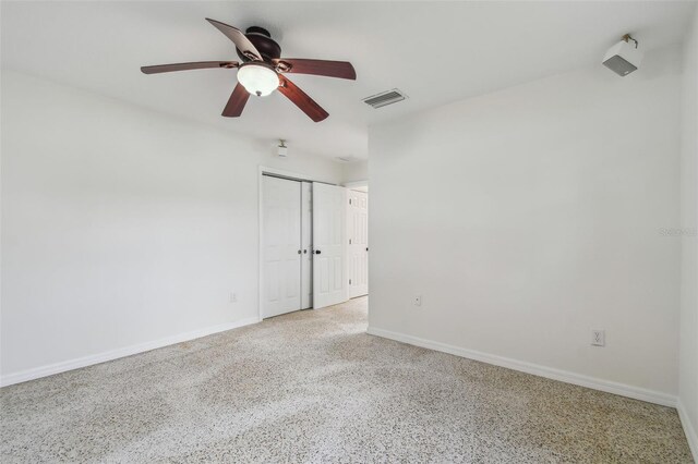 4400 Helena St NE, Saint Petersburg, FL 33703 - empty room with ceiling fan, baseboards, and speckled floor