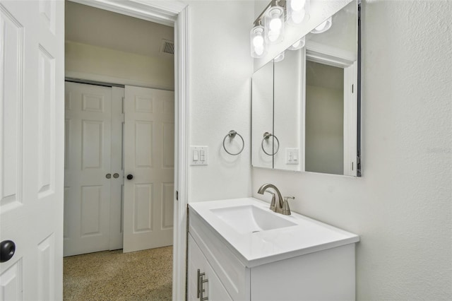 4400 Helena St NE, Saint Petersburg, FL 33703 - bathroom featuring vanity and speckle patterned floor
