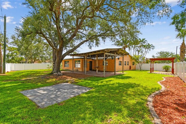 4400 Helena St NE, Saint Petersburg, FL 33703 - view of yard featuring a patio