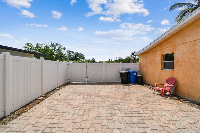 4400 Helena St NE, Saint Petersburg, FL 33703 - view of patio / terrace featuring a gate