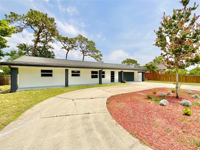 1290 Michigan Blvd, Dunedin, FL 34698 - single story home featuring driveway, stucco siding, and a garage