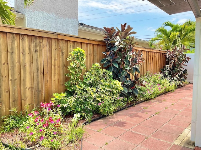 1290 Michigan Blvd, Dunedin, FL 34698 - fenced backyard with a patio