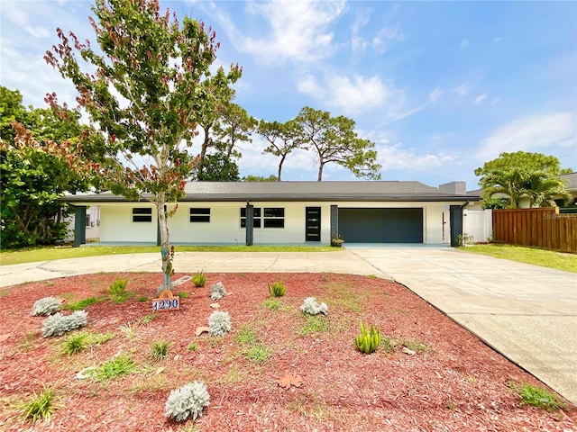 1290 Michigan Blvd, Dunedin, FL 34698 - view of front of home with driveway and a garage