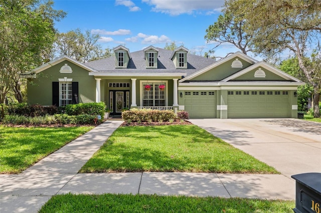 16039 Ternglade Dr, Lithia, FL 33547 - new england style home featuring stucco siding, a garage, a front yard, concrete driveway, and roof with shingles