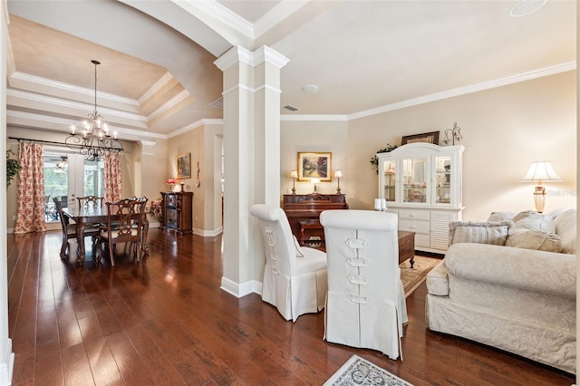 16039 Ternglade Dr, Lithia, FL 33547 - living area featuring ornate columns, crown molding, a chandelier, baseboards, and dark wood-style flooring