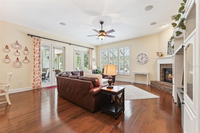16039 Ternglade Dr, Lithia, FL 33547 - living area featuring baseboards, a ceiling fan, dark wood finished floors, and a fireplace