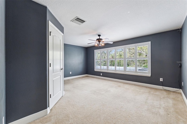 16039 Ternglade Dr, Lithia, FL 33547 - spare room featuring baseboards, a ceiling fan, light carpet, and a textured ceiling