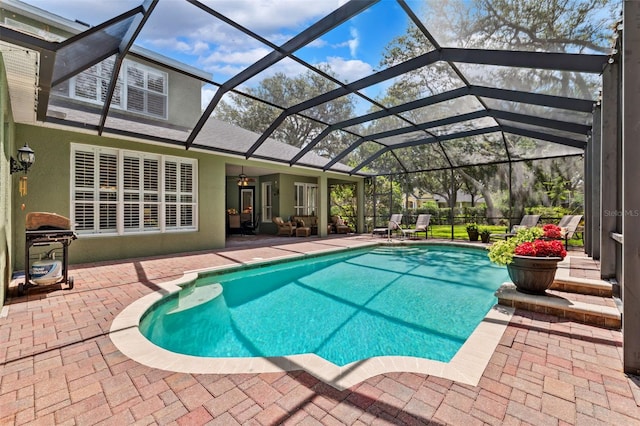 16039 Ternglade Dr, Lithia, FL 33547 - outdoor pool featuring a patio, a ceiling fan, and glass enclosure
